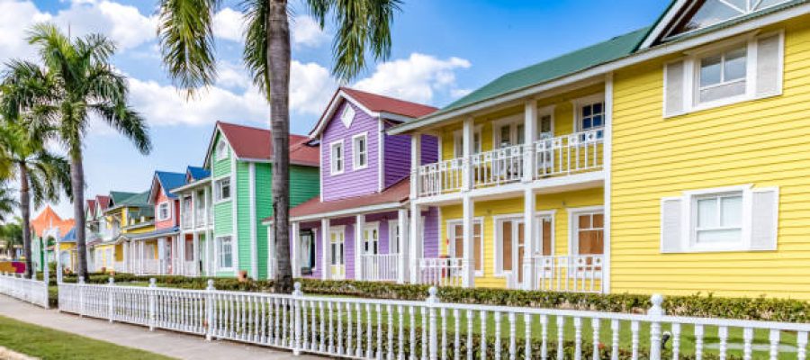 Typical dominican colorful wood houses, palm trees on an emblematic downtown street, Samana, Dominican Republic