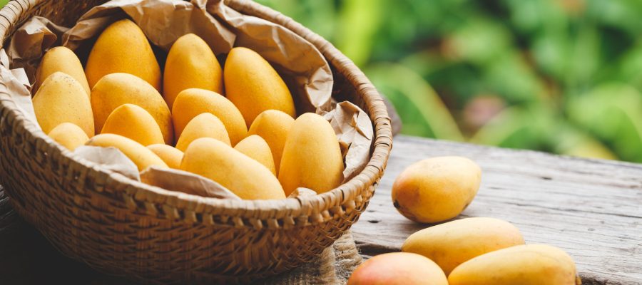 Fresh ripe mangoes in a basket