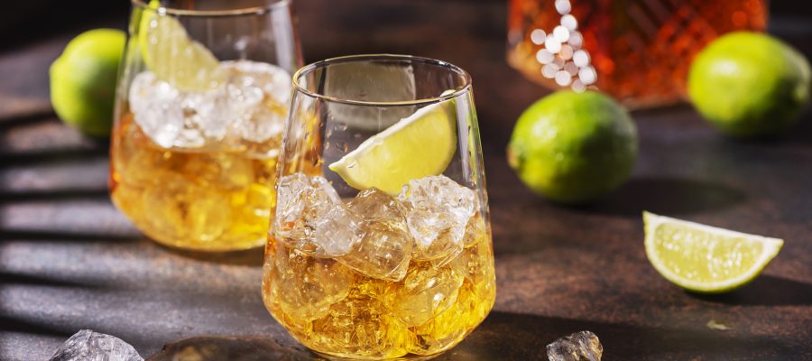 Cuban strong rum with ice and lime, summer concept with a strong shadows, selective focus image and slider format